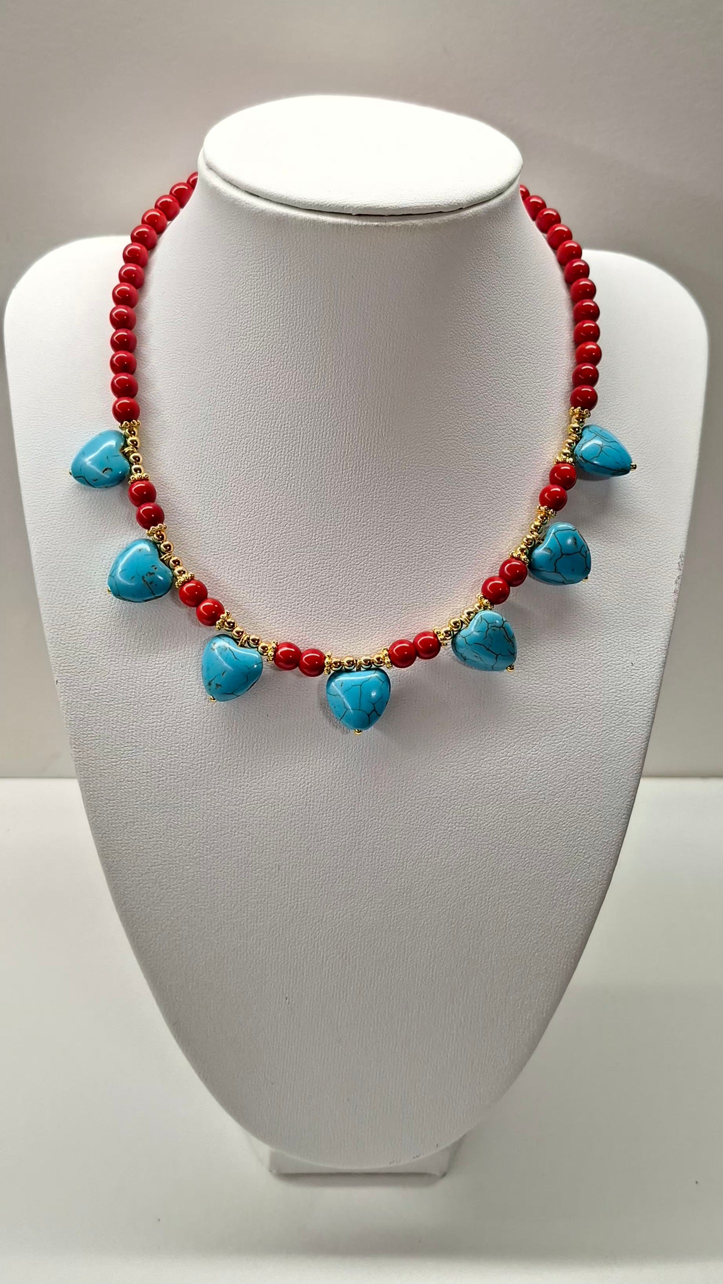 Turquoise and red beaded necklaces with hearts and eye