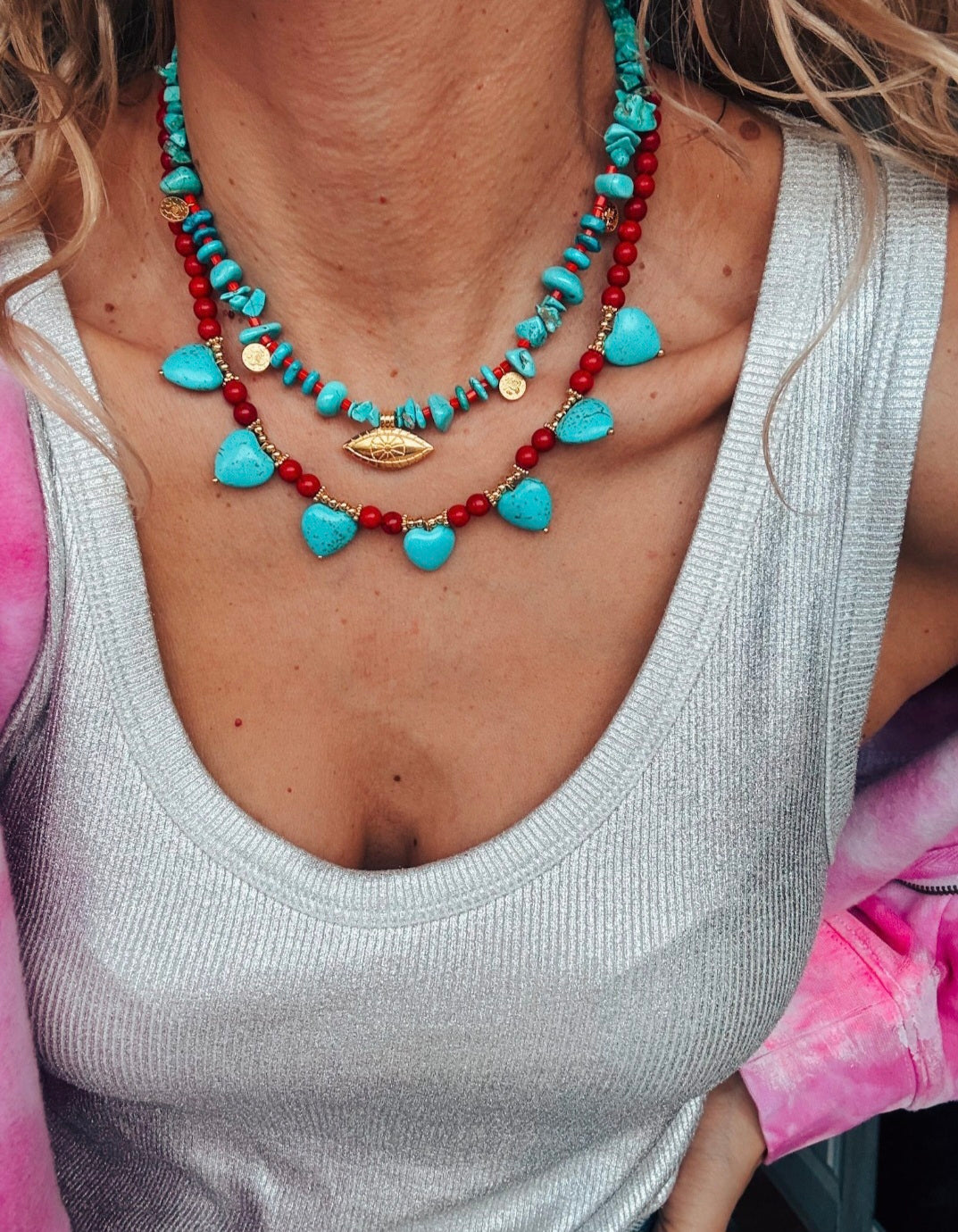 Turquoise and red beaded necklaces with hearts and eye